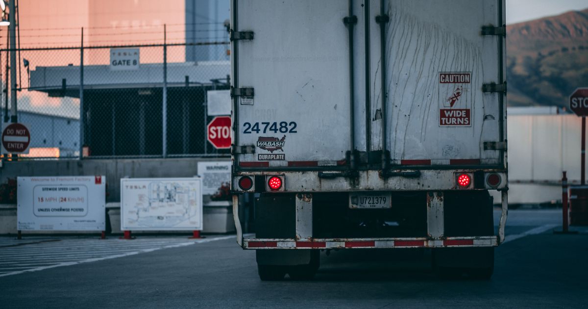 Heavy Equipment Hauling Under 49 CFR §393.130: The Rule Doesn't Require Chains — But Here's Why Every Project Trailer Carries Them Anyway