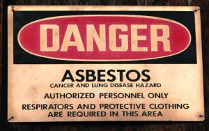 A photo of an asbestos label used in asbestos training.
