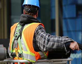 A photo of an asbestos inspector conducting asbestos inspections and third-party asbestos sampling.